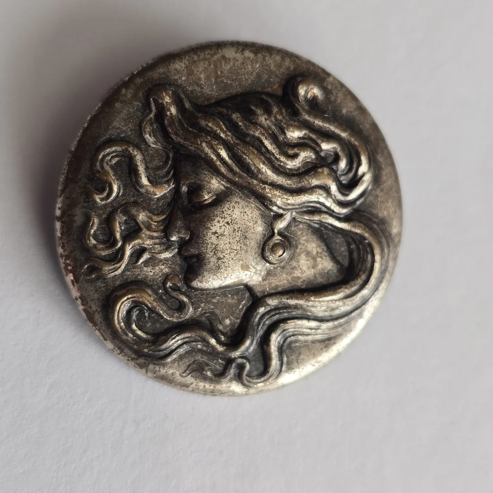 Art Nouveau style brooch woman with flowing hair dark silver tone pin